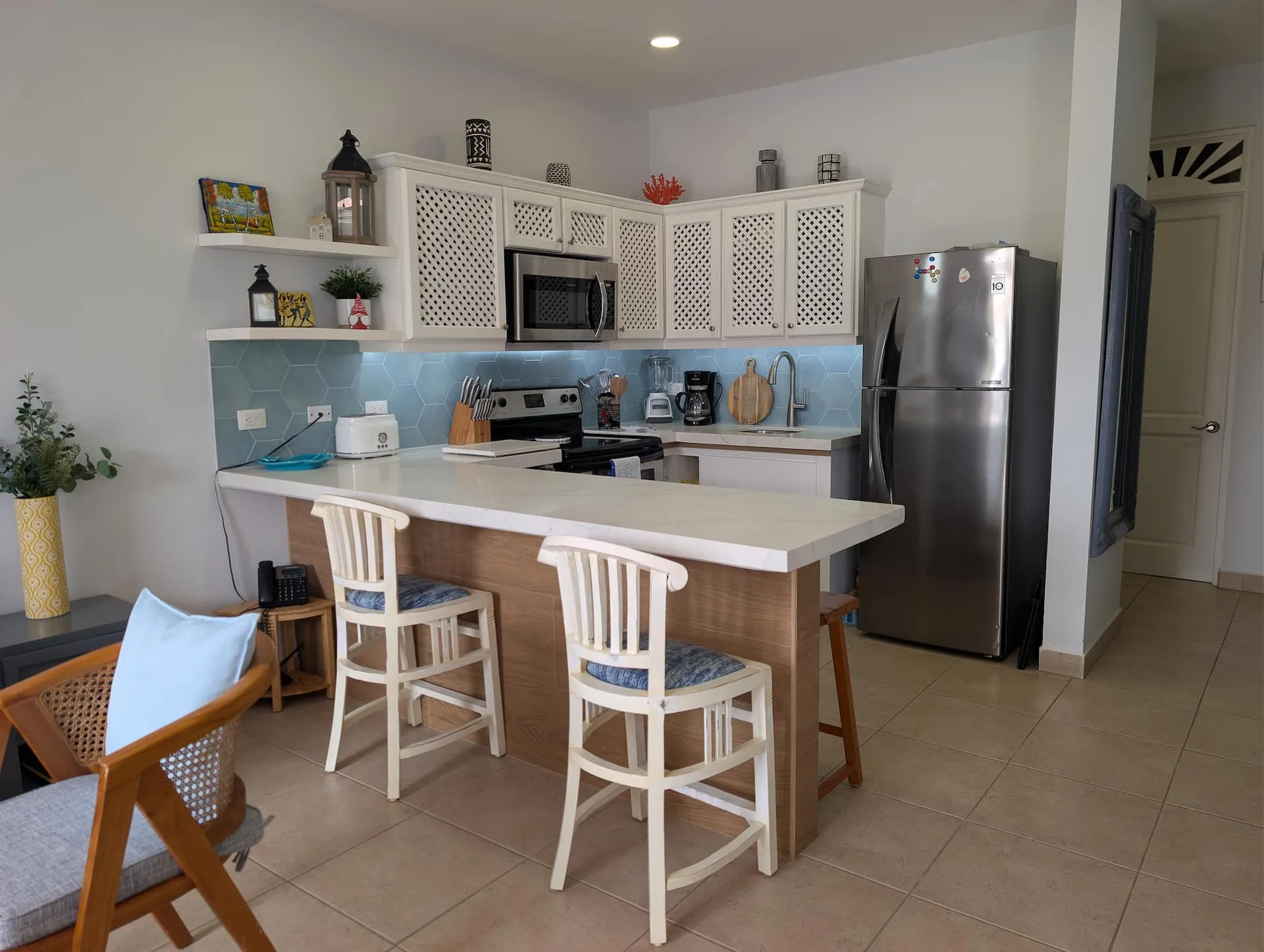 Kitchen breakfast bar with blender, toaster, and coffee maker.